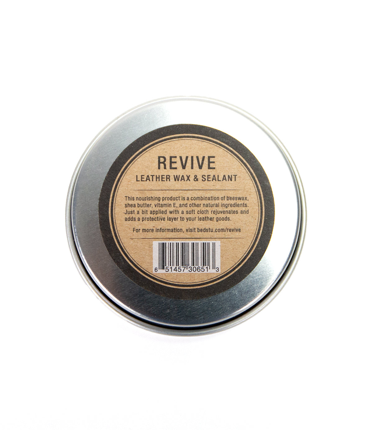 A tin of Bed Stu's Revive Leather Wax & Protective Barrier Sealant for leather products on a white background.
