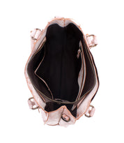 The Bed Stu Rockababy beige handbag includes two side pockets, a black interior lining, exterior buckles, and a versatile crossbody strap for added convenience.