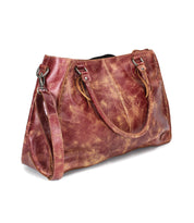 The Bed Stu Rockaway is a brown distressed leather handbag with two handles, a detachable shoulder strap, and a zip-pocket divider, shown on a white background.