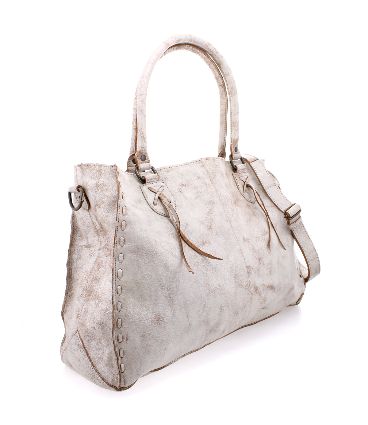 The Rockaway by Bed Stu is a spacious light gray leather handbag featuring dual handles and decorative stitching. It includes a zip-pocket divider and an optional shoulder strap for versatile carrying, all showcased against a white background.