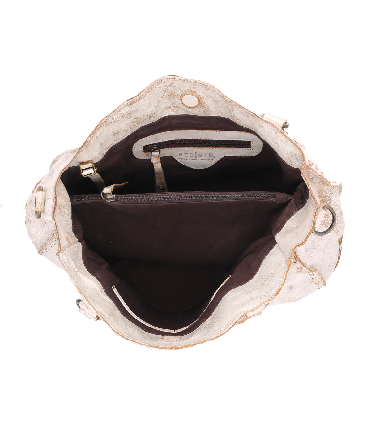 Introducing the Rockaway handbag by Bed Stu: This open beige bag boasts a brown interior with a central zip-pocket divider and two smaller compartments, ideal for organizing your essentials. It also comes with a versatile shoulder strap for easy carrying.