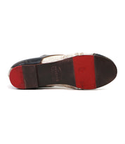 Bottom view of a used men's Bed Stu Rumba II soft leather shoe with a black and brown sole against a white background.