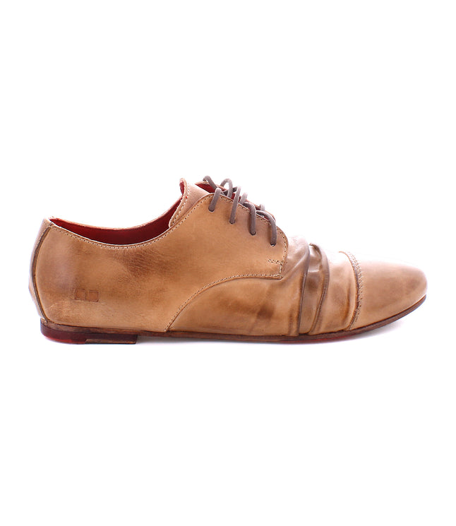 Side view of a brown leather lace-up **Bed Stu Rumba II** shoe with visible scuff marks and wear, featuring a slightly pointed toe and low heel, exuding 1920s wingtip flair.