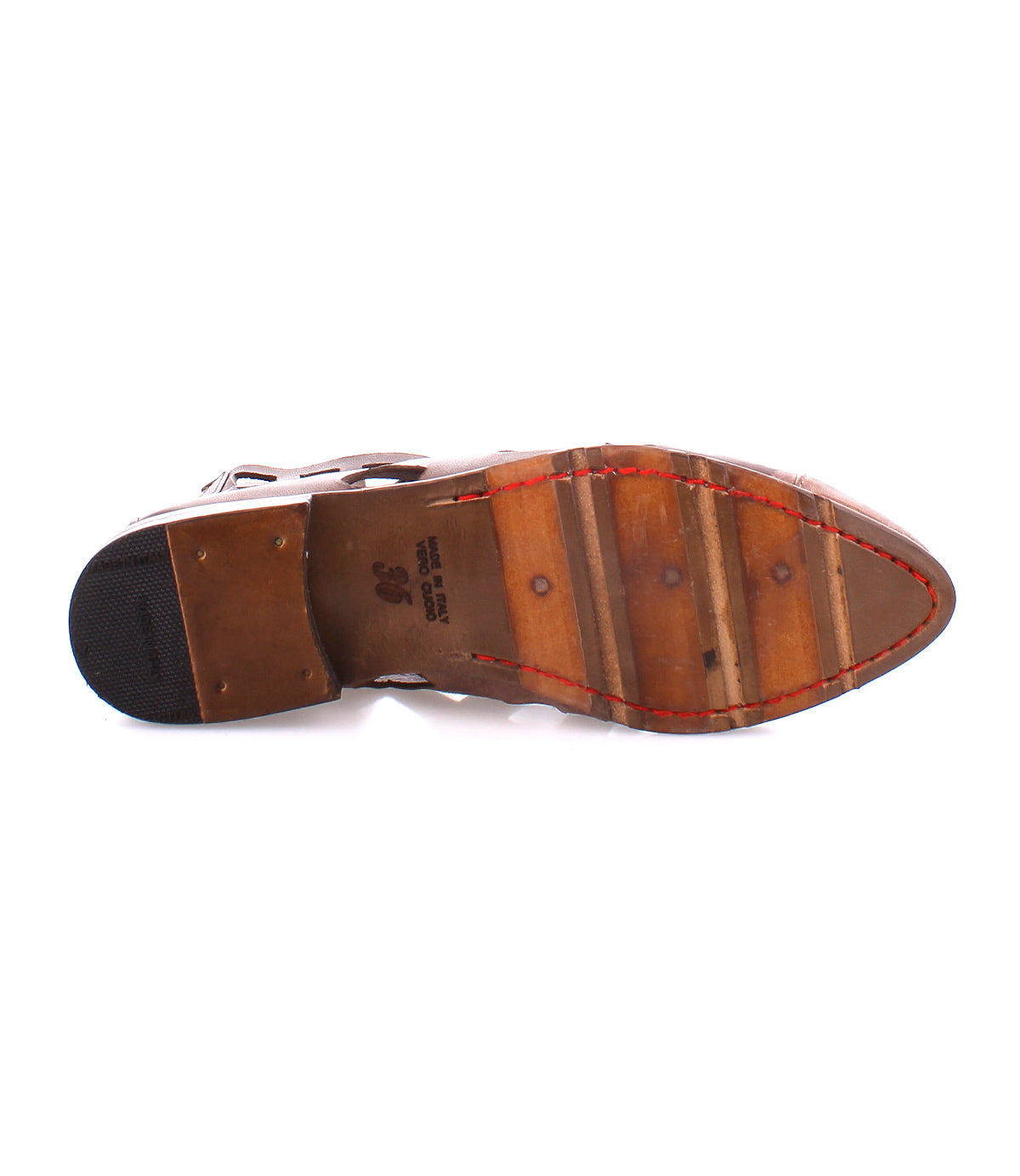 The image showcases the sole of a Bed Stu Skyline ankle boot, handcrafted in Italy, featuring a combination of rubber and wood with visible stitching and a small heel tap.