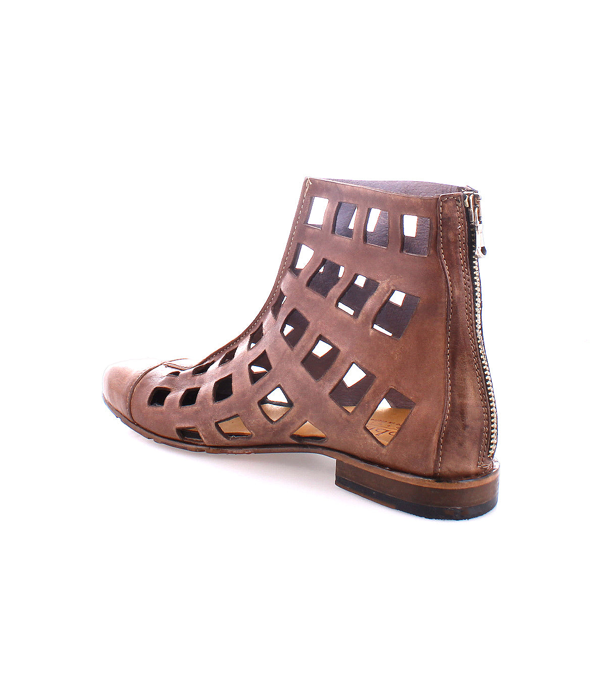 A versatile short boot, the Skyline ankle boot from Bed Stu features a brown leather design with a chic cutout grid pattern and back zipper, all handcrafted in Italy. Displayed on a white background, this piece offers both style and elegance.