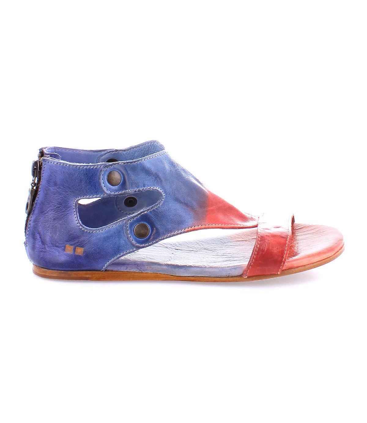 A single, colorful Soto shoe with an asymmetrical cutout design, featuring blue and red panels, a pointed toe, and a zipper on the side by Bed Stu.