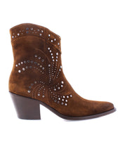 The Sposa by Bed Stu is a brown suede bootie featuring decorative silver studs, a mid-height block heel, and is crafted from vegetable-tanned leather.