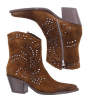 The Sposa booties by Bed Stu feature silver studs and practical side zippers, crafted from brown vegetable-tanned suede for a chic and sustainable look.