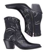 The Sposa ankle boots by Bed Stu feature black vegetable-tanned leather with silver stud embellishments and zippers. These booties have low heels and pointed toes, combining edgy style with sustainable craftsmanship.