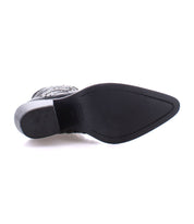 The image showcases the sole of the Sposa ankle boot by Bed Stu, highlighting its pointed toe design.