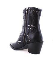 Bed Stu's Sposa ankle bootie features black vegetable-tanned leather adorned with decorative metal studs and a side zipper.