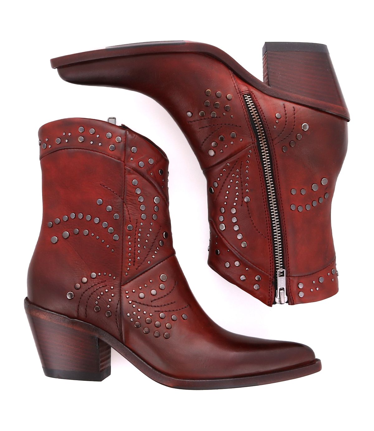Introducing the Sposa by Bed Stu: a pair of brown leather booties adorned with decorative stitching and metal studs. One bootie is showcased standing upright, while the other lies on its side, highlighting the zipper and heel crafted from premium vegetable-tanned leather.