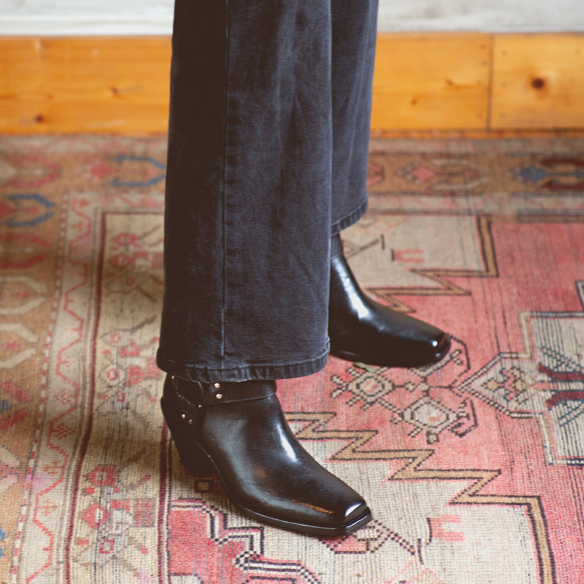 An Italian person standing on a Vamoose rug from Bed Stu.