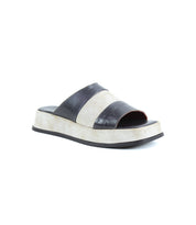 The Bed Stu Vext is a single open-toe platform slide sandal with a thick white leather-wrapped sole and a wide black leather strap across the top, displayed on a white background.