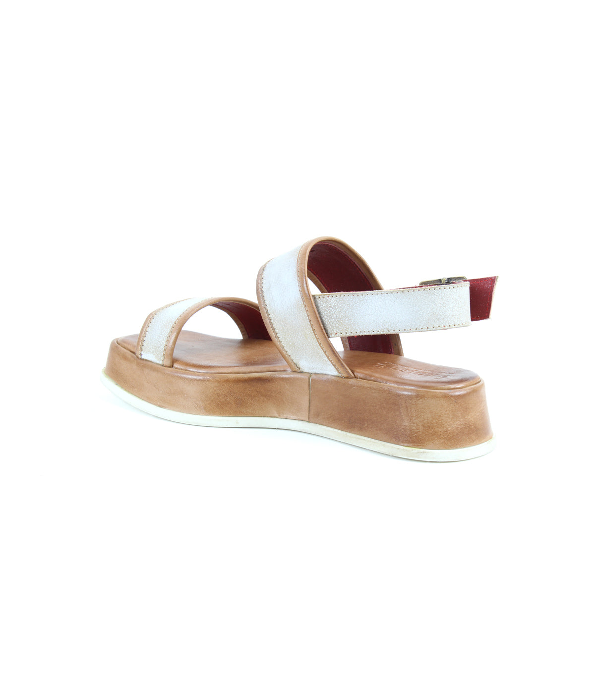 The Bed Stu Vice is a platform sandal featuring a thick tan sole, white straps, an adjustable ankle strap, and a red accent on the heel strap, shown from a rear side angle.