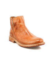 The Bed Stu Yurisa is a light brown leather ankle boot with a round toe, red leather lining, visible stitching, and a low stacked heel—an ideal everyday style.