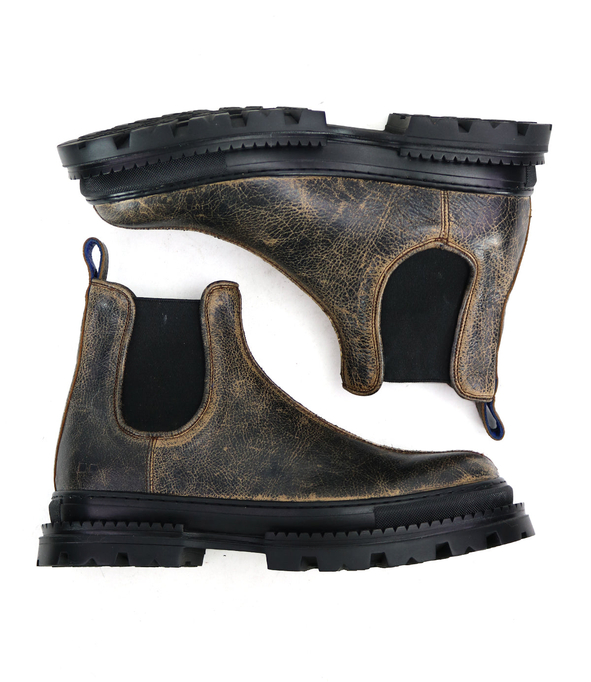 The Bed Stu Accelerate boots are brown, distressed leather Chelsea boots featuring black elastic side panels and a rugged lug outsole, displayed side by side on a white background.