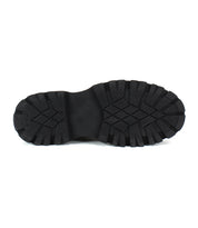 The Bed Stu Accelerate features a black rubber sole with a rugged lug outsole and deep tread pattern, shown from the bottom against a white background.