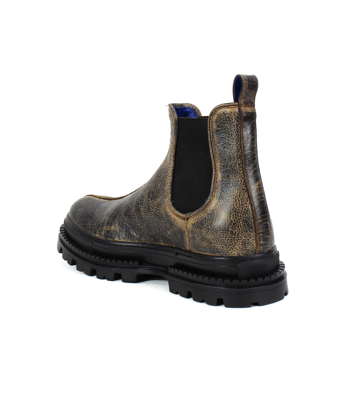 The Bed Stu Accelerate Chelsea boot features distressed brown leather, a rugged lug outsole, black elastic side panel, and sturdy black sole—all seen from a back side angle.