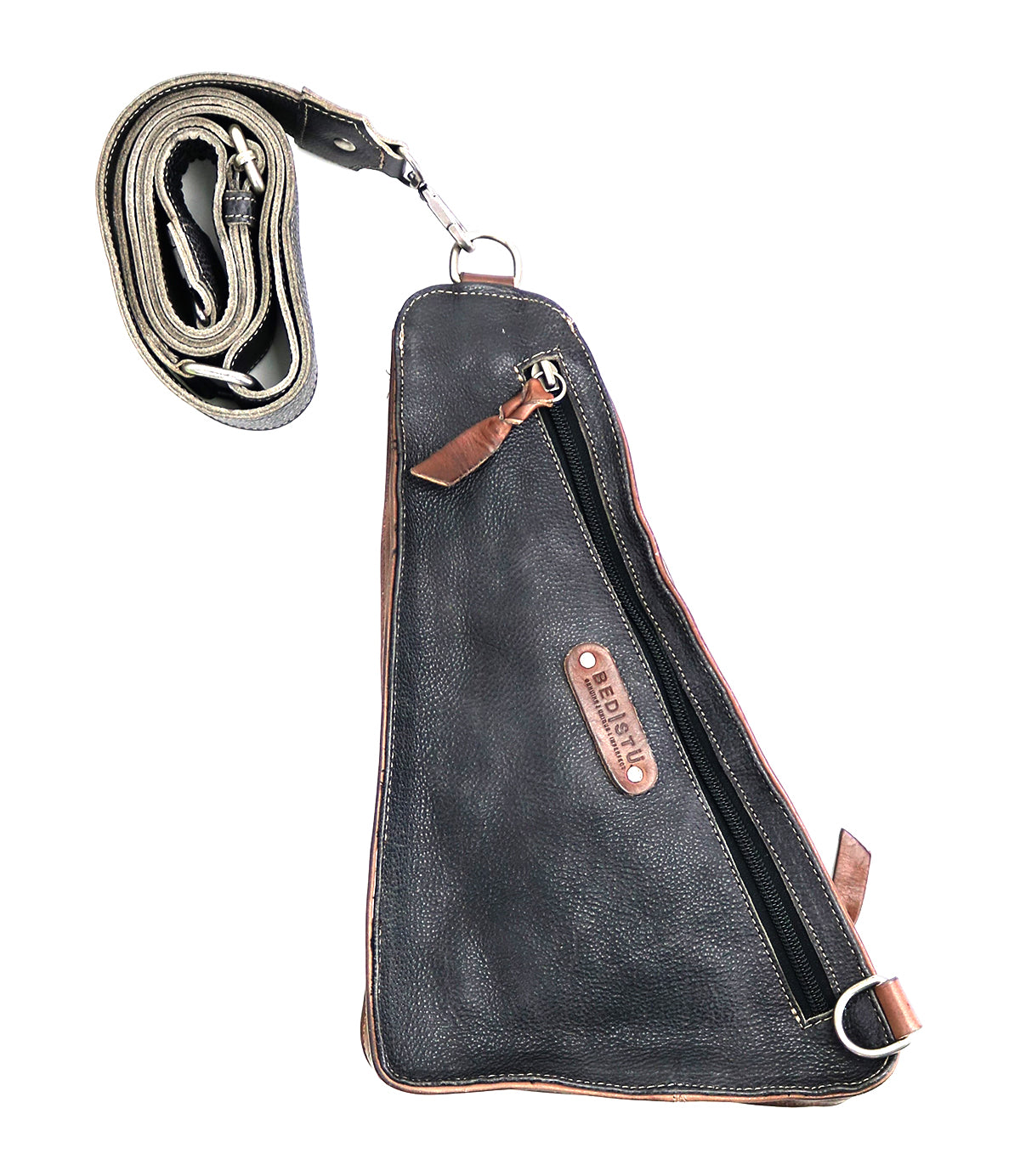 A versatile crossbody bag, the Adept by Bed Stu features a prominent zipper, brown accents, and a branded label in the center. Crafted from vegetable tanned leather, it includes an adjustable, detachable strap, making it the perfect travel companion.