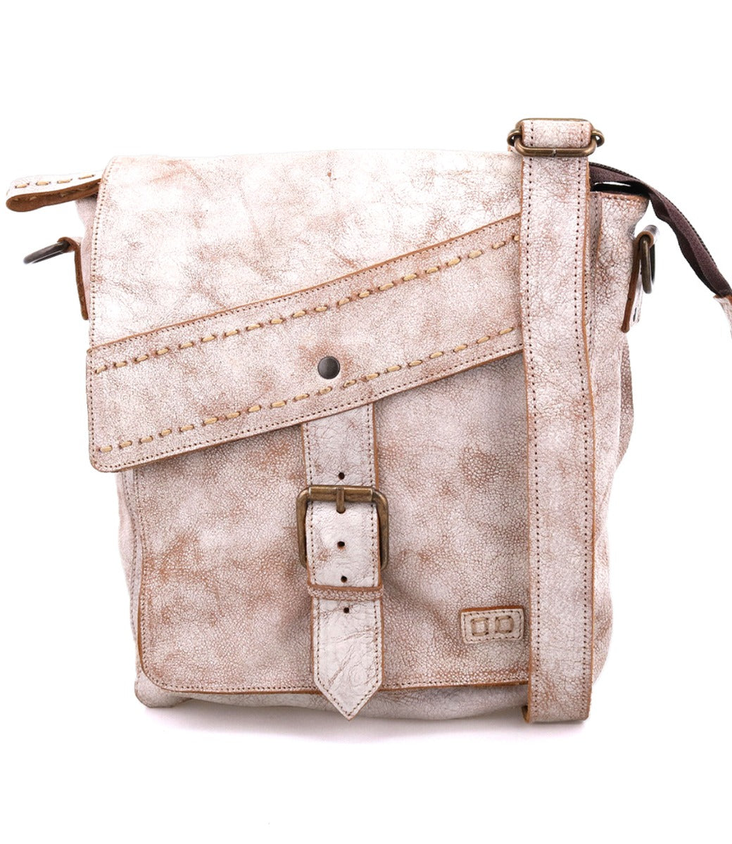 A Bed Stu Ainhoa LTC leather crossbody handbag with a front flap, buckle closure, and an adjustable strap, isolated on a white background.