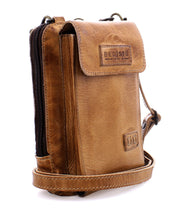 An Alelike brown premium leather crossbody bag from Bed Stu, featuring a flap closure, an adjustable strap, and the brand name visible on the front—an ideal mix of everyday functionality and style.