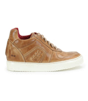 Side view of Bed Stu's Andromeda tan leather high-top sneaker, featuring a white rubber sole, beige laces, a hidden heel, and decorative stitching—exuding a street-smart design.