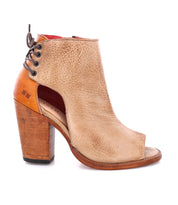An Angelique women's ankle boot with a wooden heel by Bed Stu.