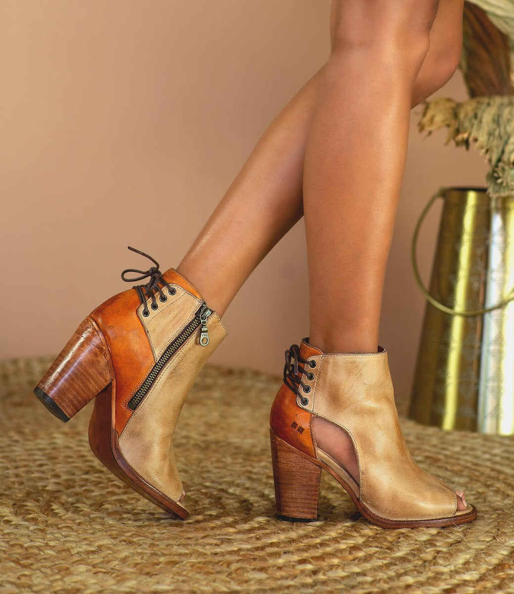 A woman wearing a pair of Bed Stu Angelique ankle boots.