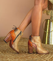 A woman wearing a pair of Bed Stu Angelique ankle boots.