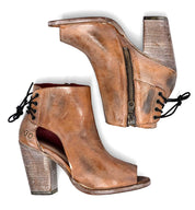 A pair of Angelique ankle boots in tan leather by Bed Stu.
