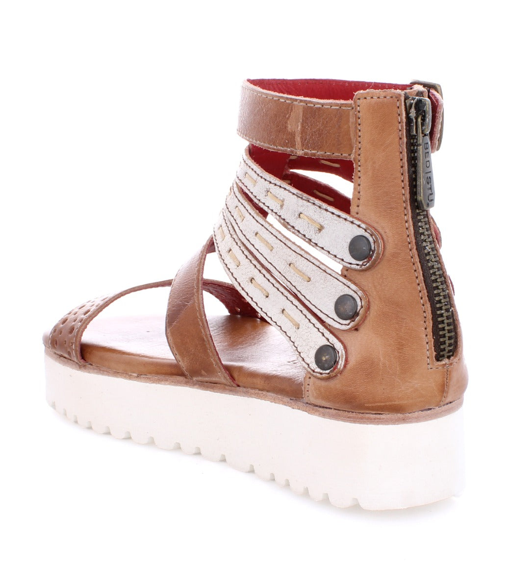 A pair of Artemia sandals by Bed Stu in tan with white straps.