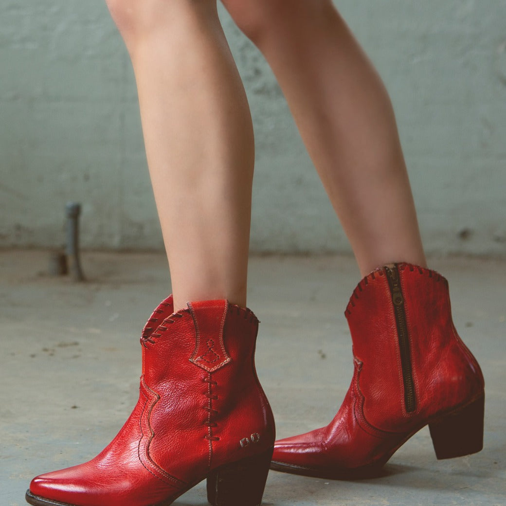 A woman wearing a pair of Baila II by Bed Stu red cowboy boots.