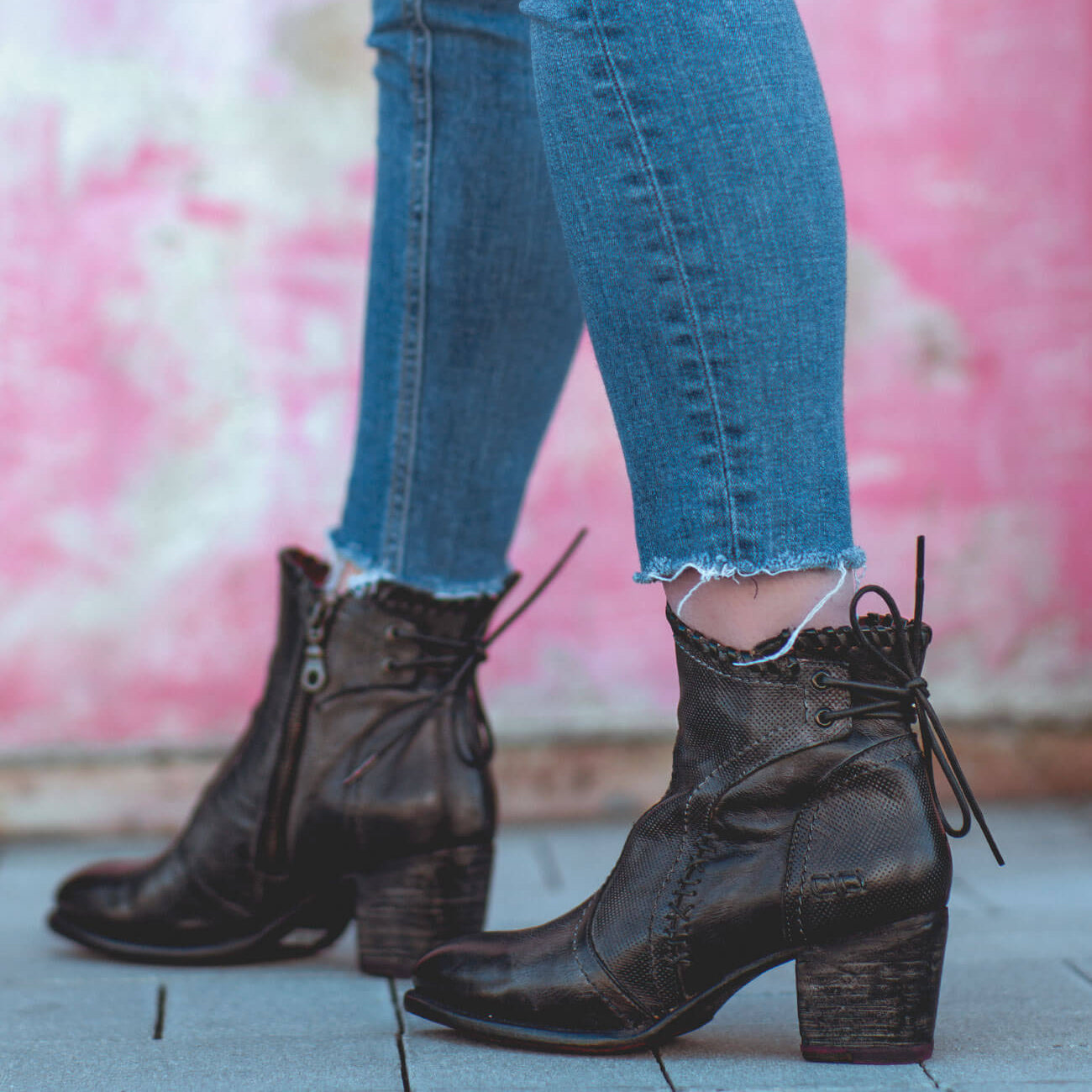 A woman wearing Bia jeans and Bed Stu black ankle boots.