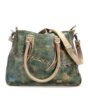 A teal Bed Stu Bruna leather bag with straps.