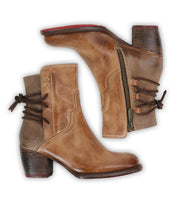 The Bed Stu Cable boots are brown, hand-finished leather mid-ankle boots with side zippers, back lace-up detail, and stacked wooden heels, displayed from side and top perspectives.
