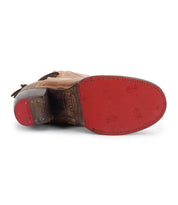 The Bed Stu Cable is a brown hand-finished leather shoe shown from the bottom, boasting a red rubber sole with visible branding and stitching, and hints of Western flair.