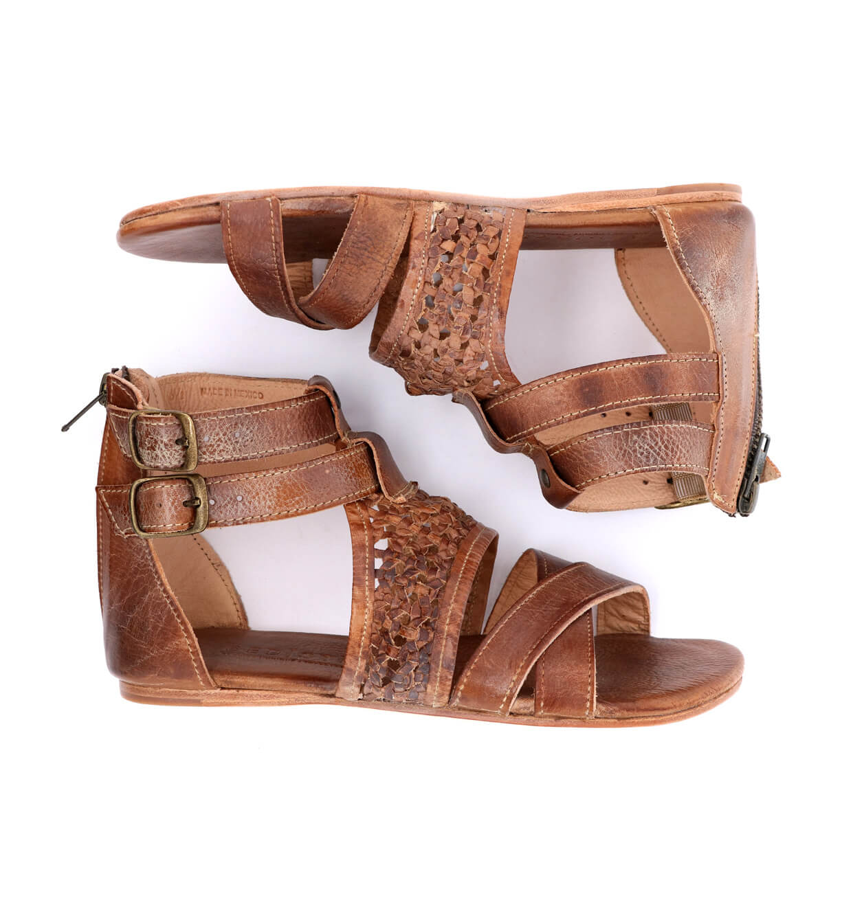 A pair of Capriana women's brown sandals with straps and buckles. Brand: Bed Stu.