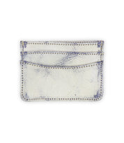 The Chuck by Bed Stu is a compact white wallet with blue distressed accents, visible stitching, and two convenient card slots.