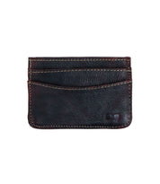 The Chuck card wallet by Bed Stu is a convenient and compact black leather accessory, featuring three visible slots and eye-catching red stitching details.