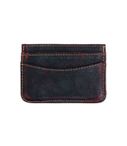 The Chuck by Bed Stu is a compact black leather card wallet with a textured surface and visible stitching, featuring two convenient slots for holding cards.