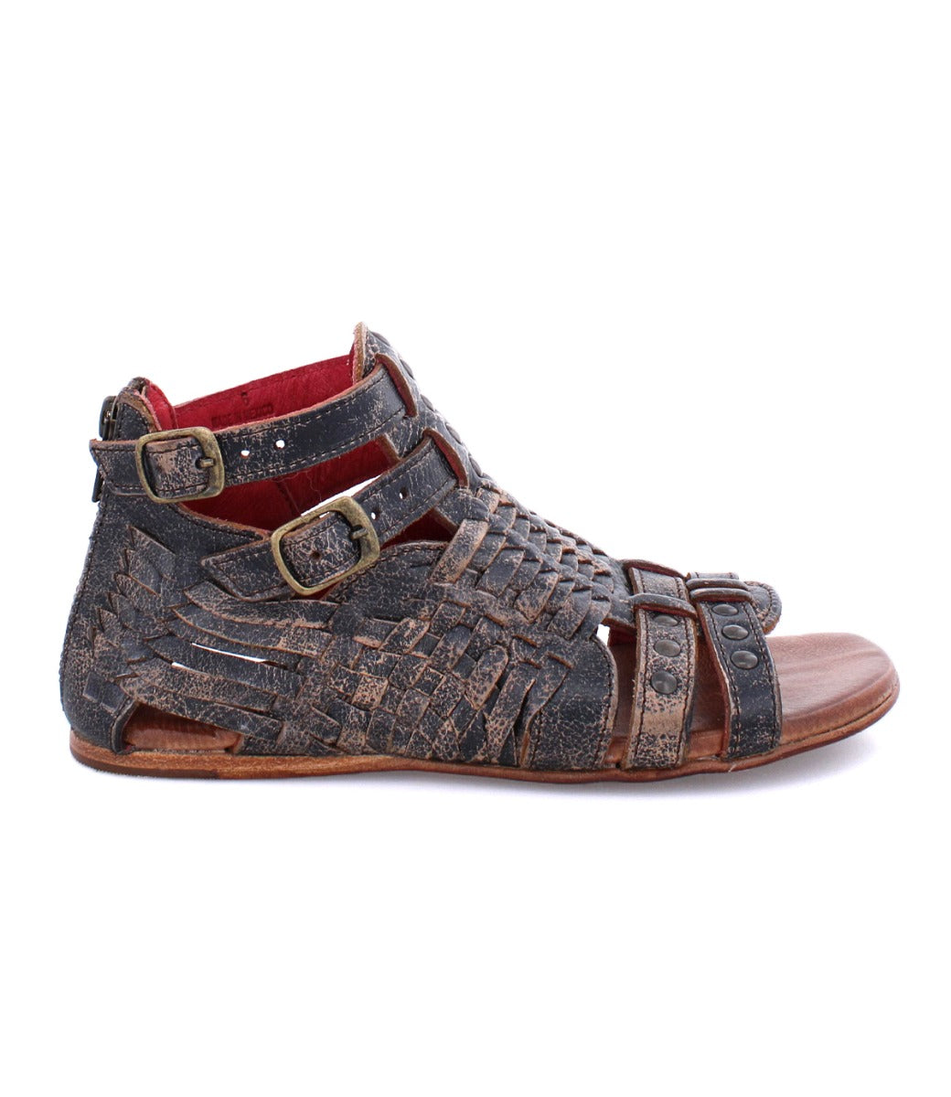 A pair of Bed Stu Claire III brown sandals with braided straps.