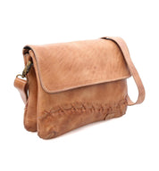 A tan Cleo leather crossbody bag from Bed Stu with an adjustable strap.