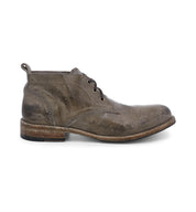 A pair of Bed Stu Clyde men's grey leather chukka boots on a white background.