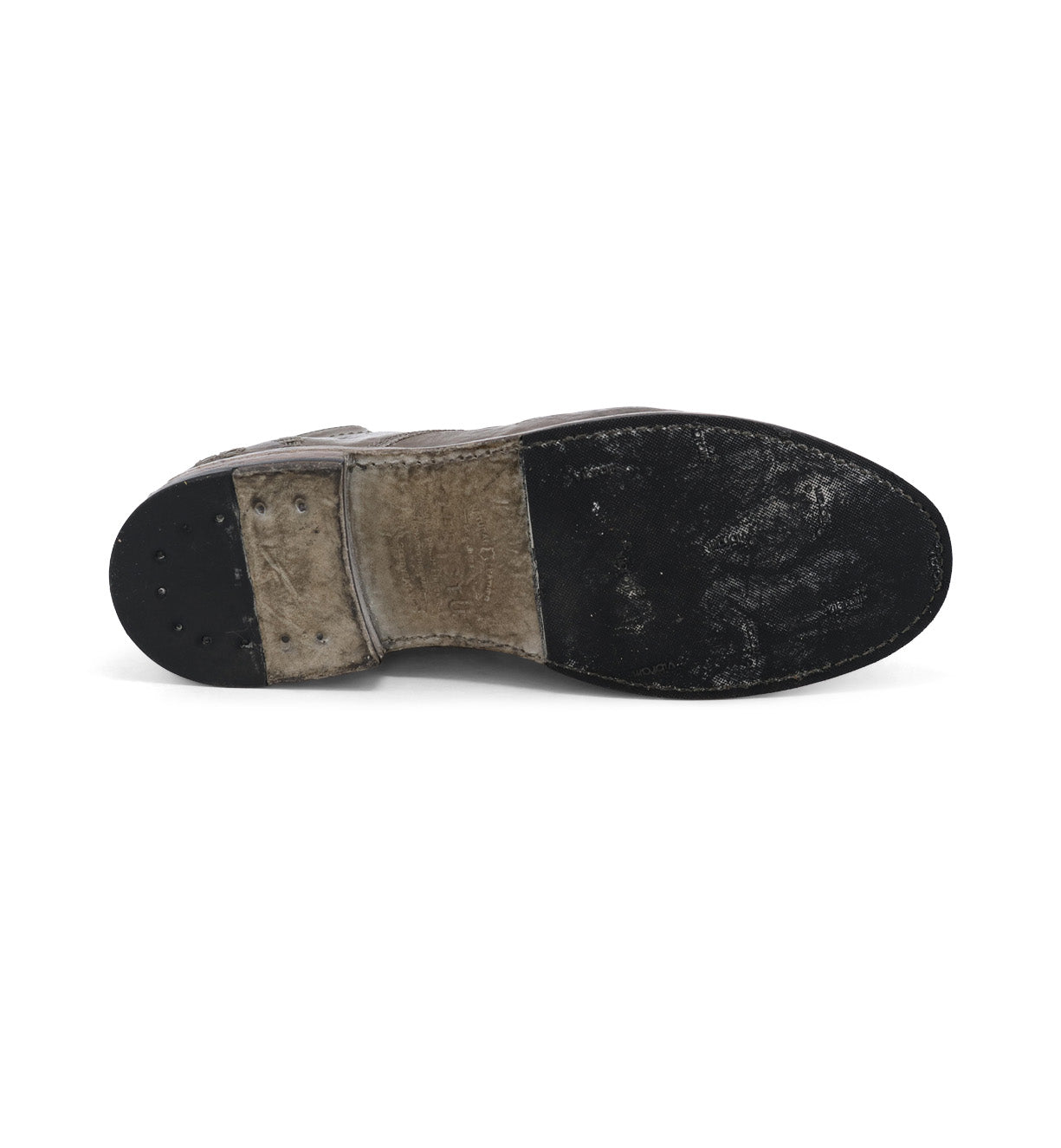 A pair of Clyde shoes with a black sole on a white background by Bed Stu.