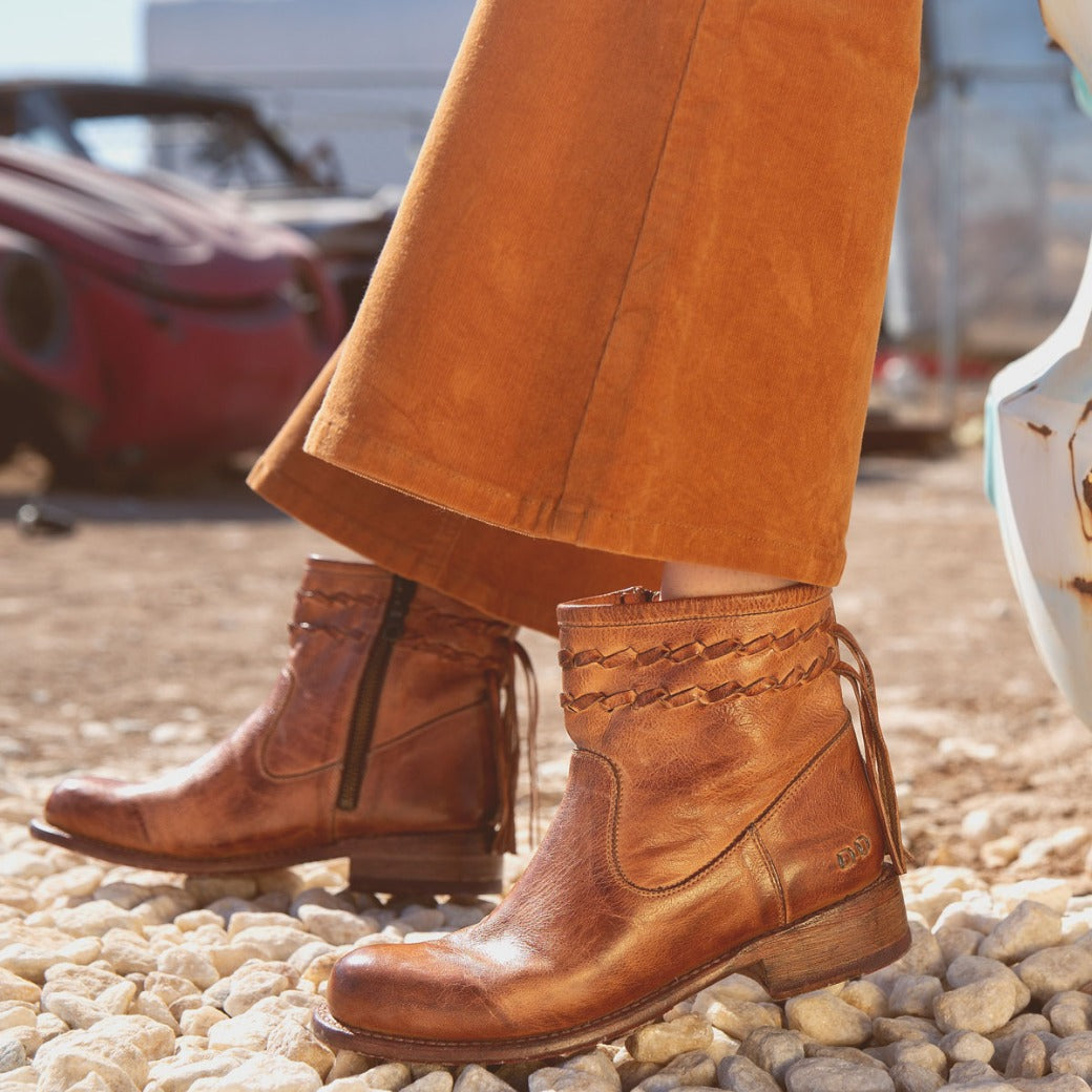 A woman wearing Craven boots by Bed Stu.