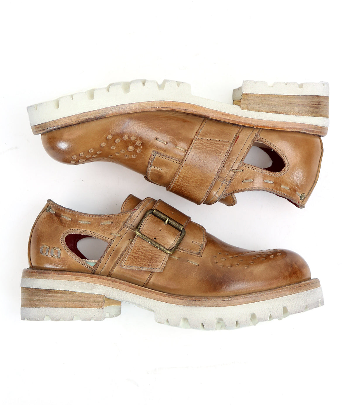 A pair of brown leather Dagny shoes by Bed Stu with perforated detailing and buckles.