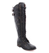 A women's black Della boot with laces and buckles, made by Bed Stu.
