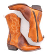 A pair of Deuce leather cowboy boots from Bed Stu with rustic charm and a zipper on the side.