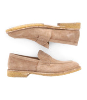 A pair of Envoy loafers in tan suede by Bed Stu, featuring rubber soles and viewed from the side, are elegantly positioned one above the other against a white background, exuding timeless sophistication.